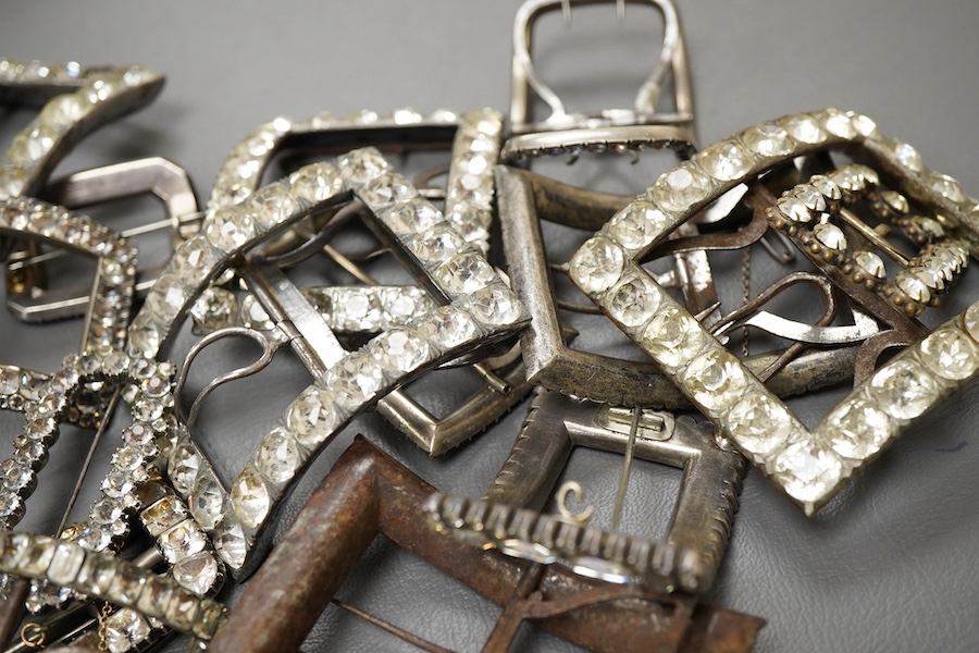 A large collection of shoe buckles, 18th-19th century, of rectangular outline, set with pastes, mostly mounted in steel, a minority in silver, some with later brooch fittings